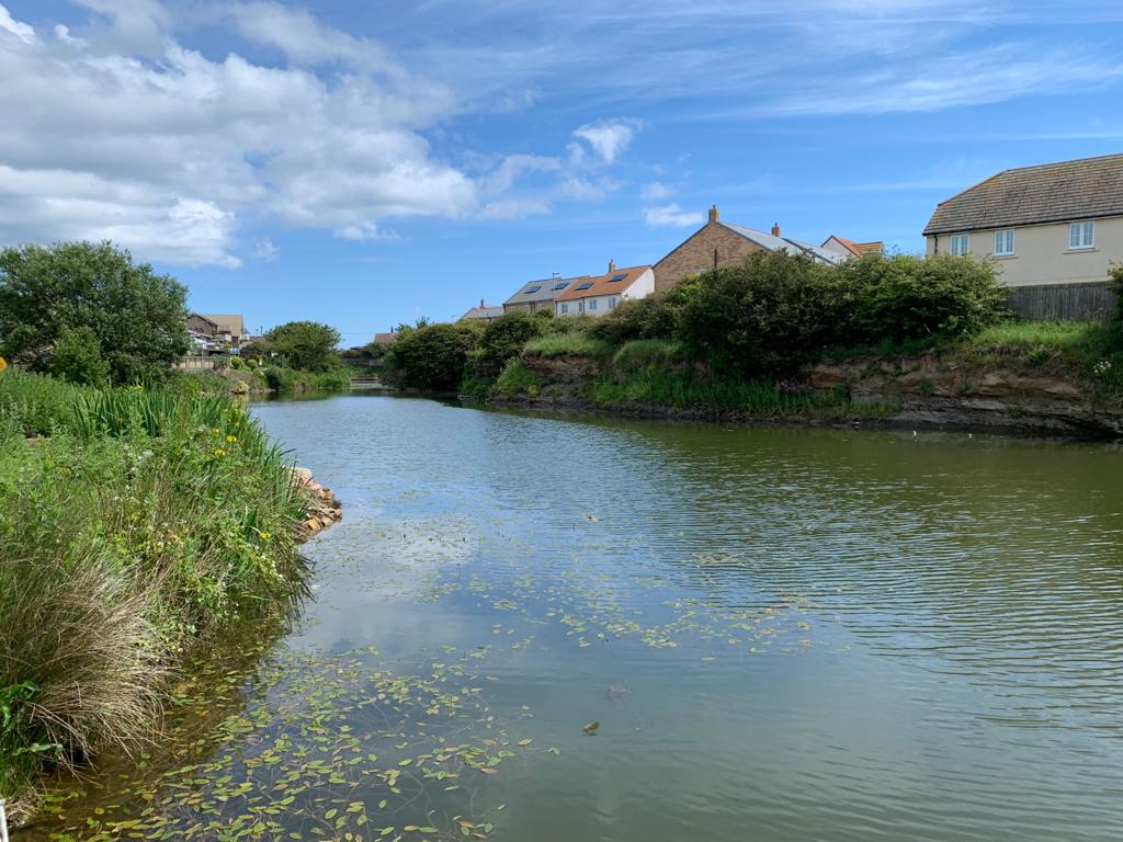A shot down the length of the old quarry lake in Beadnell.